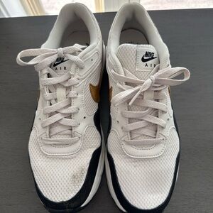 Nike White Mesh Sneakers with Black and Gold Accents